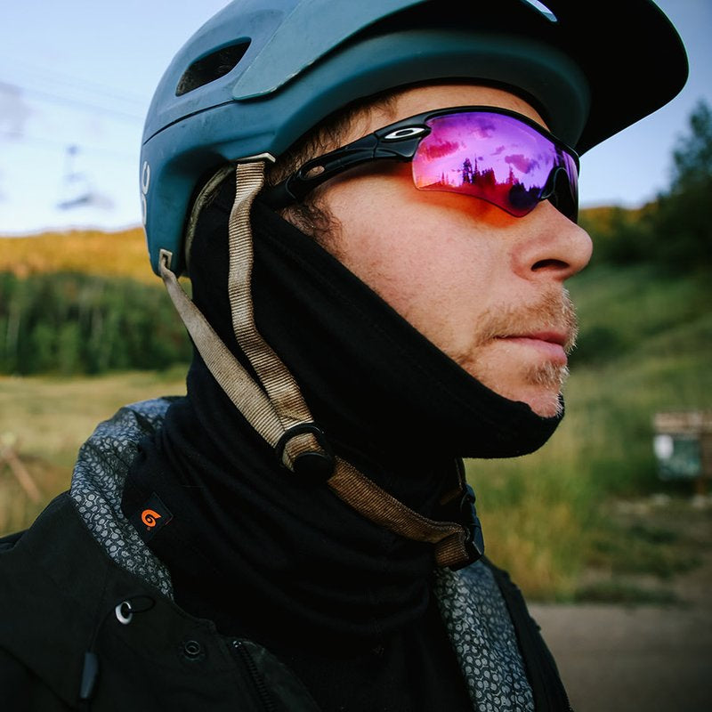 Mountain biker wearing Point6 Merino Wool neck gaiter