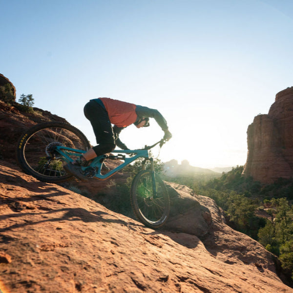 Point socks being worn by a mountain biker downhill on cliffs