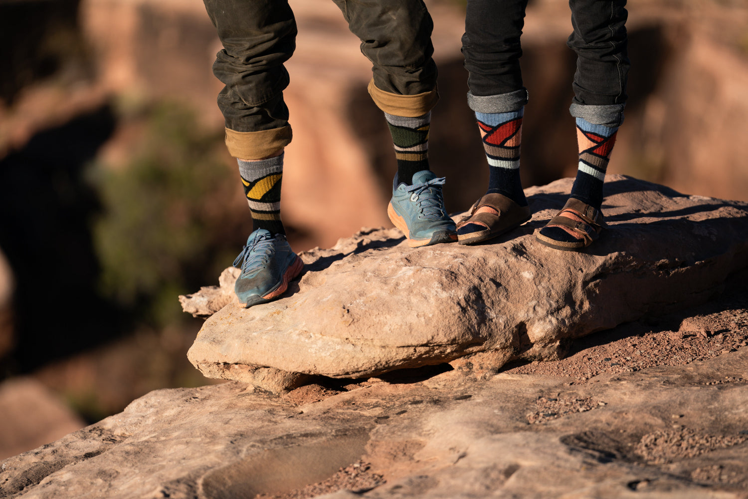2 people standing wearing Point6 Socks  on a mountain hike